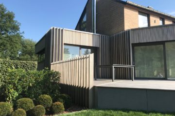 Exemple de revêtement de façade réalisé par Menuiserie Pirlot.